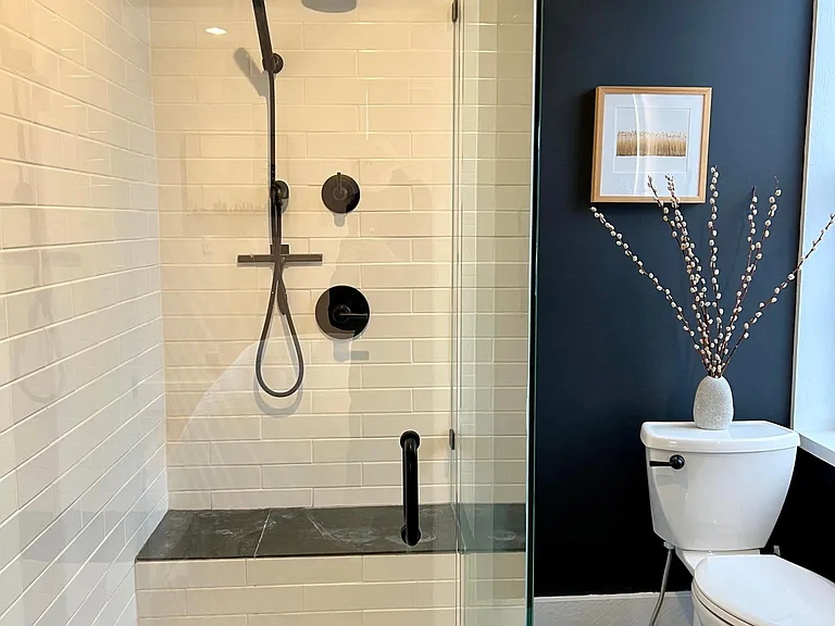 Newly remodeled custom bathroom honed slate tile, solid marble shower base, custom cabinetry.