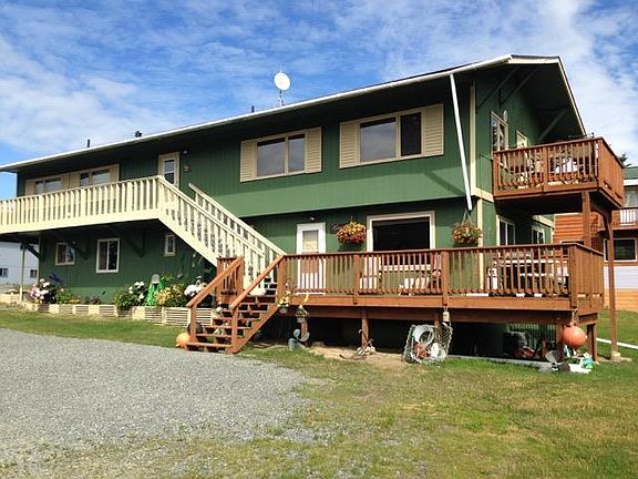 A small set of Stairs lead to the main entrance to the apartment.