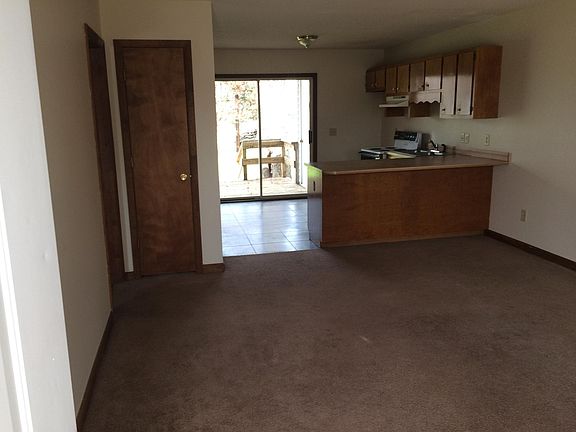 interior view from front door, showing living room, counter 