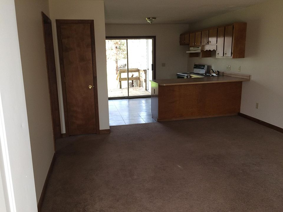 interior view from front door, showing living room, counter 