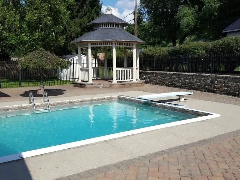 In-ground swimming pool with a self-cleaning robot.
Pool area enclosed with black aluminum fencing with 1600 sq ft brick pavers.
Professionally custom built Gazebo with 8 columns and rope lighting.