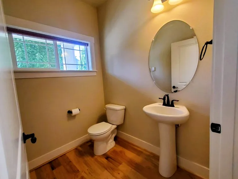 Half bathroom /powder room downstairs (new tile flooring not seen in picture)