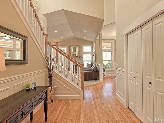 From family room looking towards the front of the house. Formal living room is straight ahead. Entrance and office/den is located to the right.