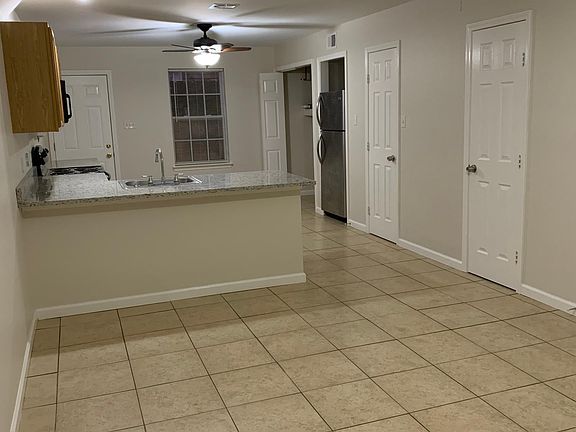 Open floor plan. View from front door into Living room and kitchen.