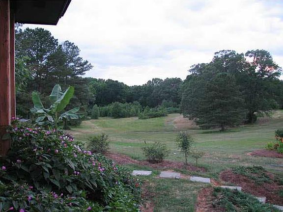 House with 12 acres provides plenty of room to customize the property for your interests.