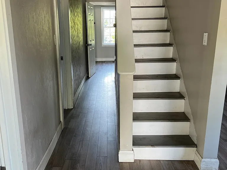 upstairs leads to 3rd (primary) bedroom and 2nd bathroom