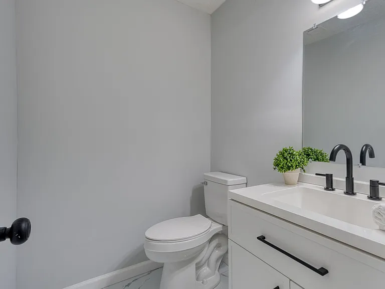 half bathroom off the kitchen area.