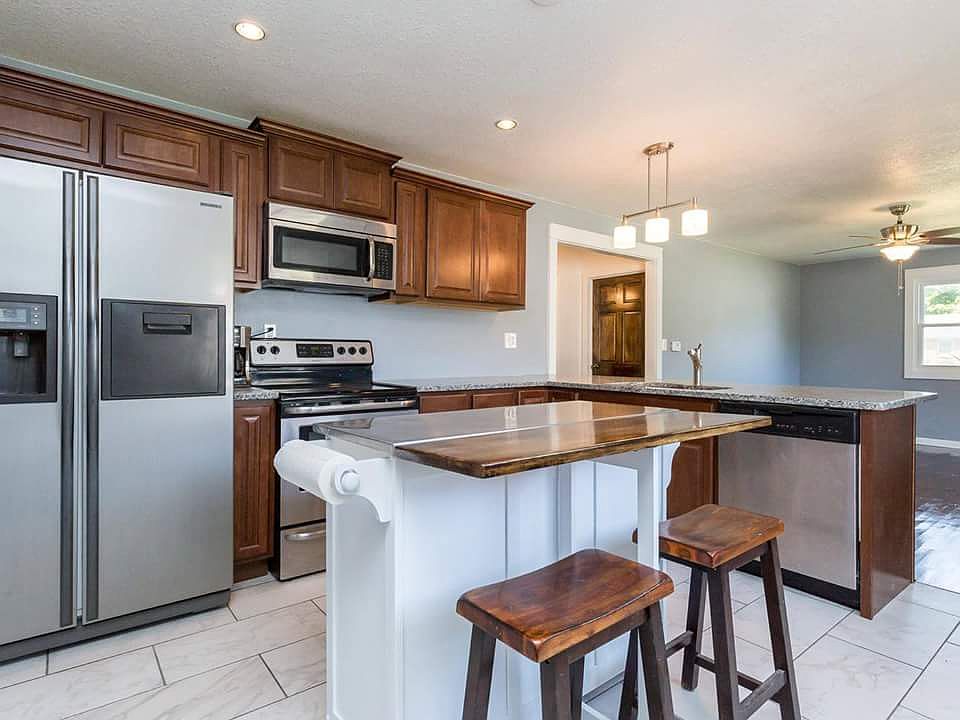 Kitchen with movable island.