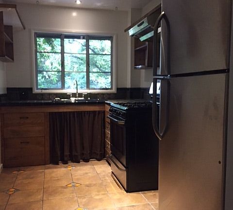 Kitchen with new appliances, gas stove, and garbage disposal