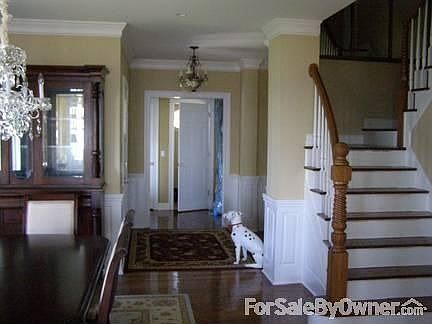 Foyer Entrance
						:
						Foyer entrance, view of the dining room and the stairs to the 2nd and 3rd floors