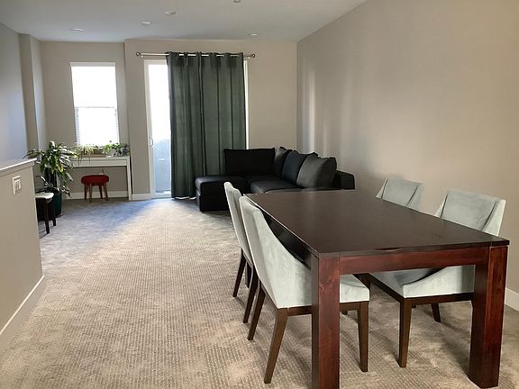 Living and dining area with balcony/deck