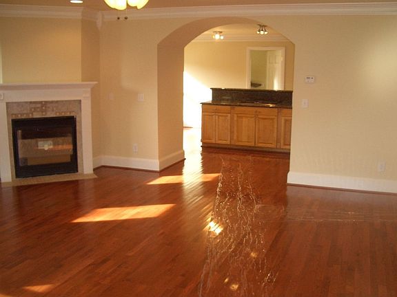 Hardwood floors, crown molding, gas log fireplace in living room