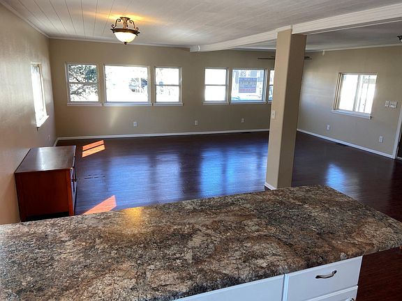 Huge living room + Dining area completely open with western windows looking out to the Golden Foothills 5 minutes away