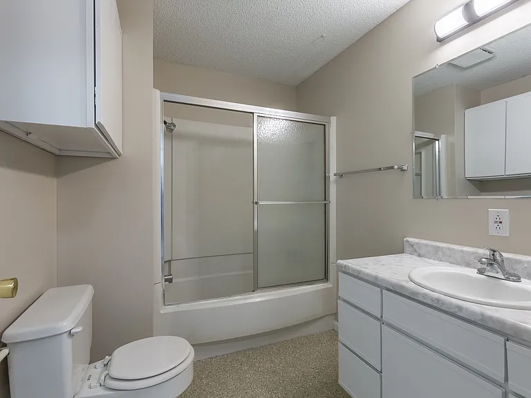 Large bathroom with bright lighting at Rosewater.