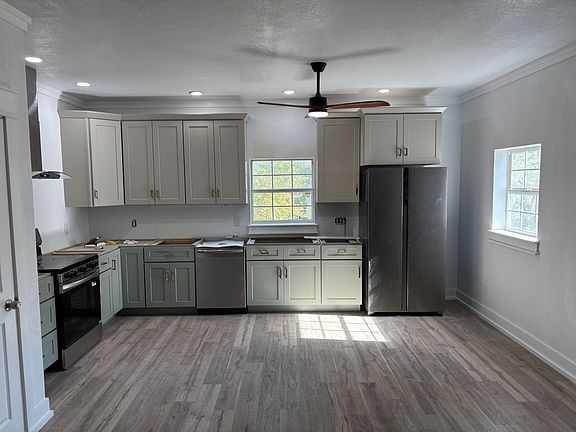 Large open kitchen with all new stainless steel appliances. Granite countertops. Extra-large sink with garbage disposal.