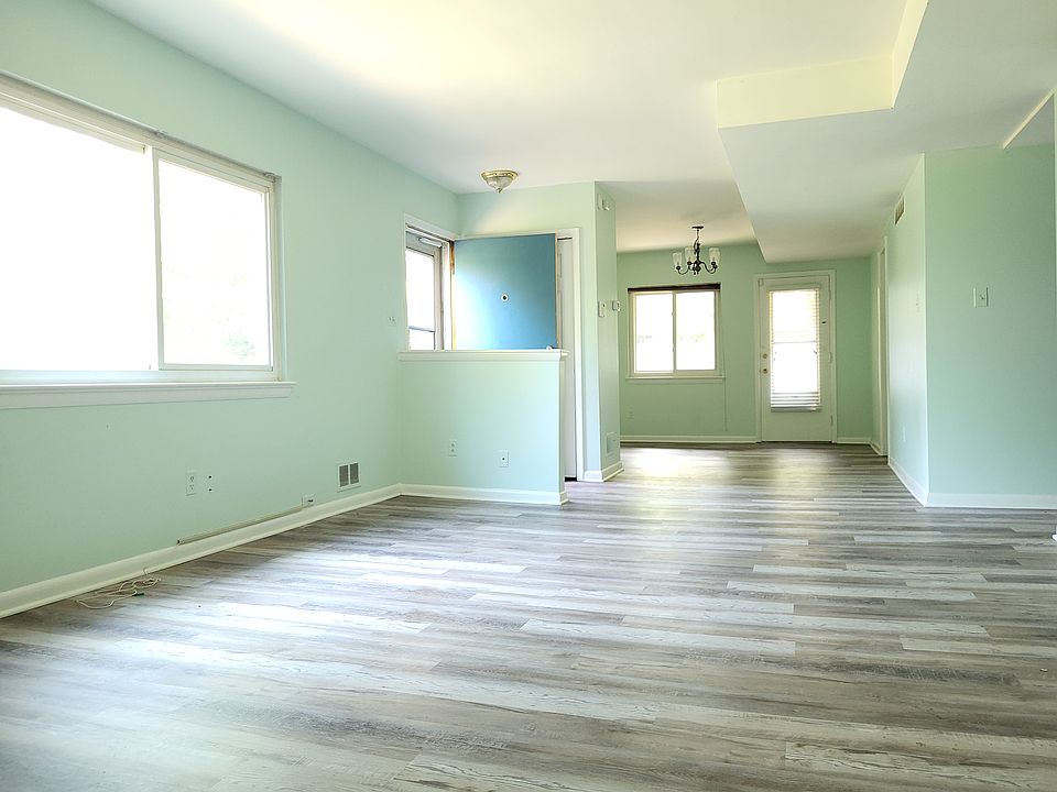 Living room, entrance, and dining room