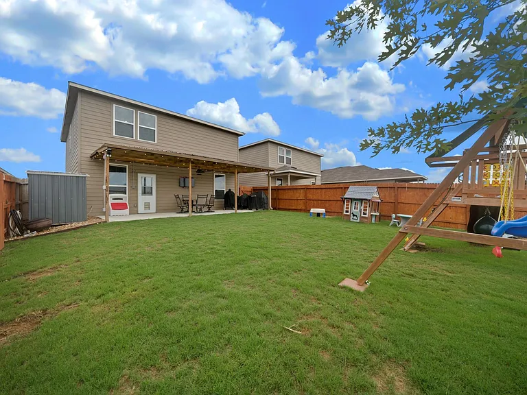 Large backyard! 
Over-sized covered patio w/ fan & lights!!
Storage shed!