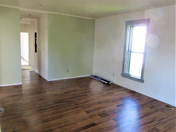 great room looking towards the kitchen - new flooring and paint