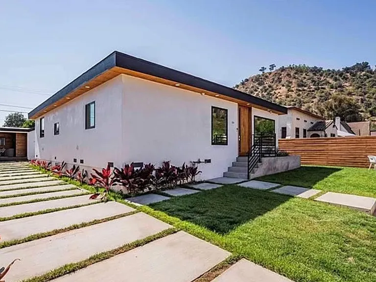 Make the front yard an outdoor living space! The property is entirely fenced in with a Ring camera on the front door and security cameras surrounding the front house.