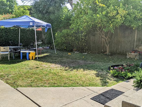 Rear unit opens directly to the shared backyard