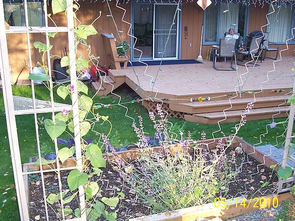 view of back deck from upper yard