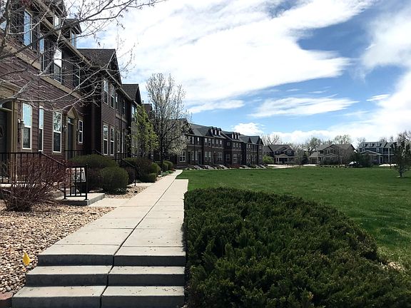 Front of town-home faces west with unobstructed view looking across large lawn (HOA serviced).