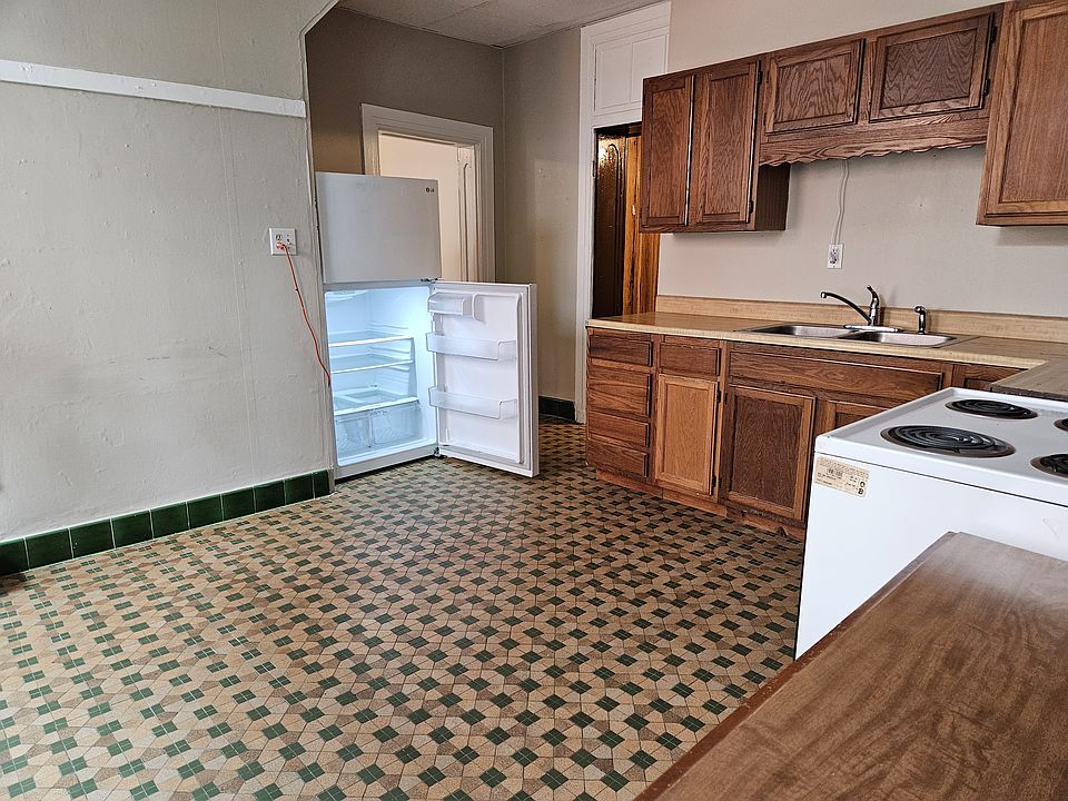 Large Kitchen including Stove and Refrigerator. Large Walk in Closet, Storage Room or Nursery off of kitchen.