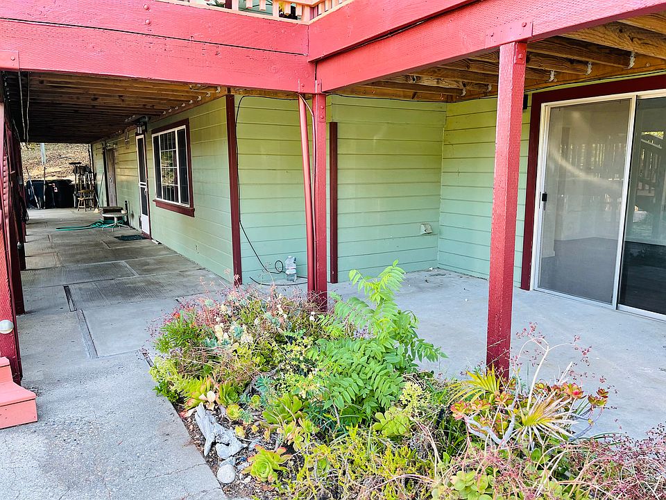 Sliding door entrance to bedroom on right, front door and picture window of living room on left.