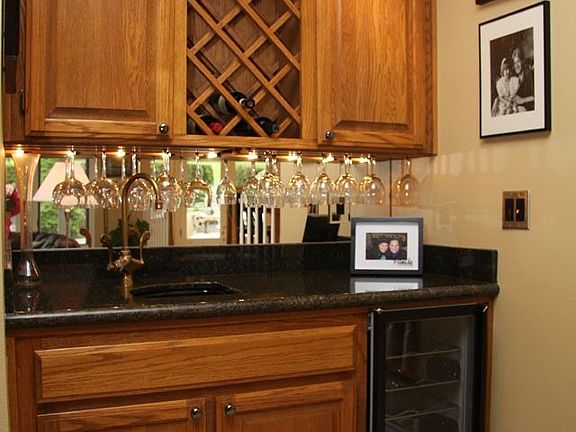 Wet bar in family room has a built-in wine fridge!