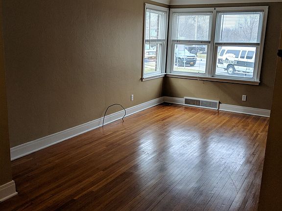 Spacious living room with hardwood floors