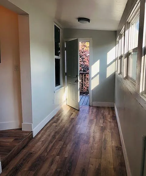 Sunroom that is lined with windows can be used as an office of hobby room.