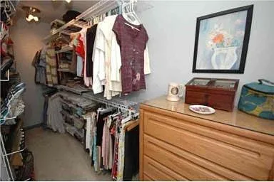 Walk-in closet, primary bedroom.