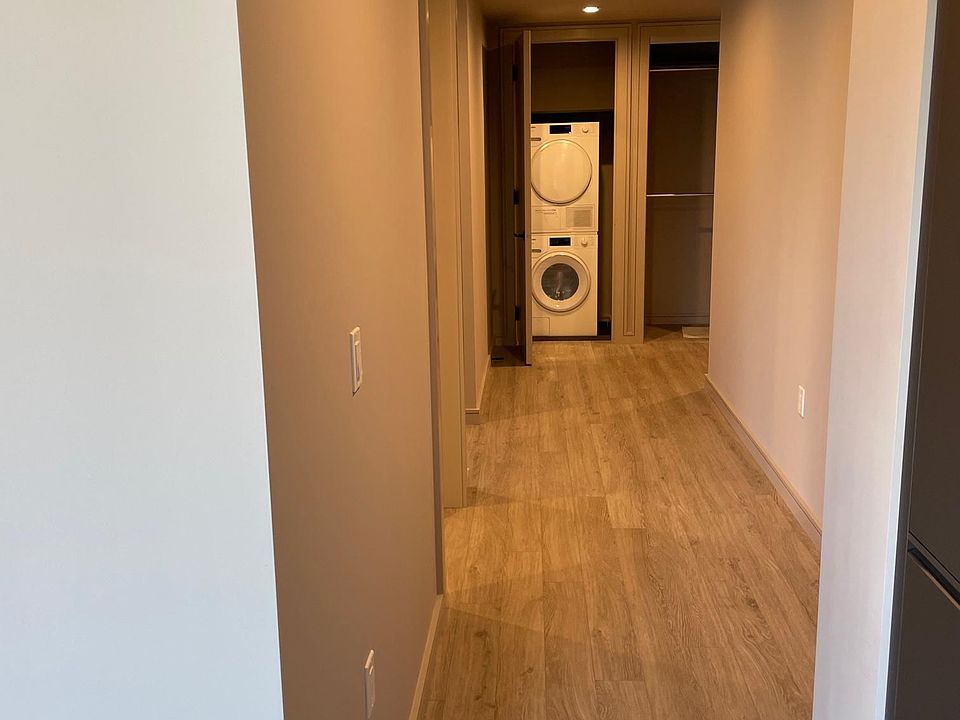 Hallway leading to the Master Bedroom and stacked Washer/Dryer closet