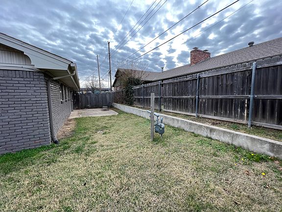 Part pf the back yard and side yard