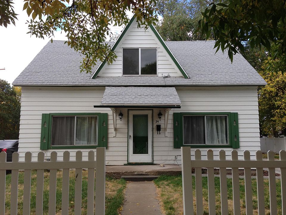 View from the street, the entry door and private driveway is on the left side.
