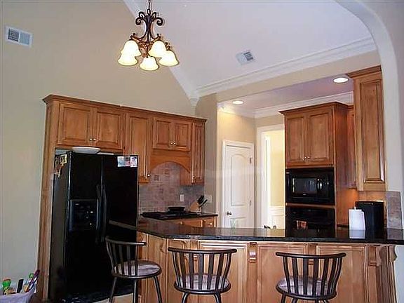 Kitchen has vaulted ceiling