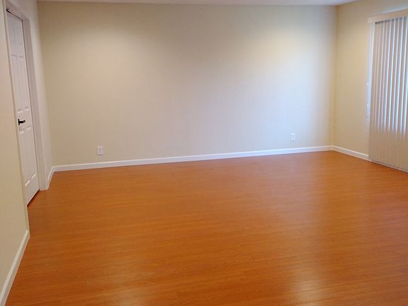 Living room with recessed LED lights and laminate wood floor