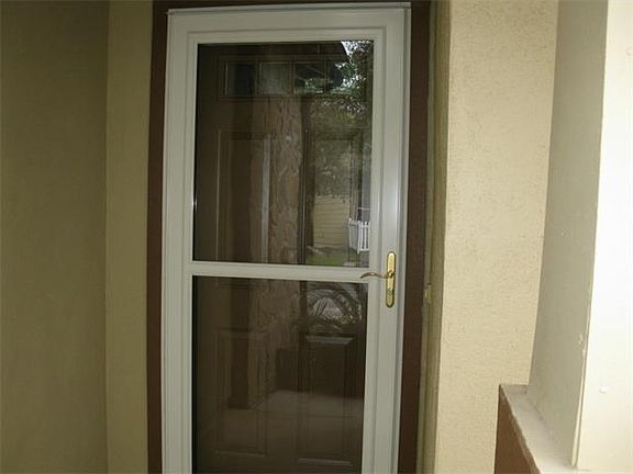 Heavy duty storm door on front