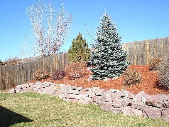 Private backyard with retainer wall