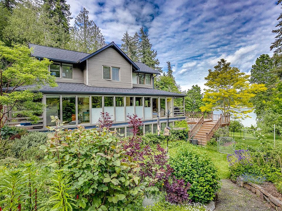Upper house, entrance to daylight apartment around front of deck on water side.