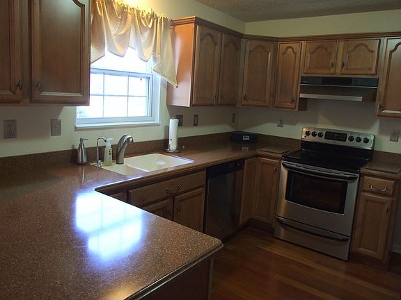 New kitchen - stainless appliances, Corian counters & sink, gorgeous cabinets