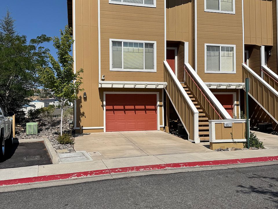 View of townhouse from the street. End unit has extra windows on the side.