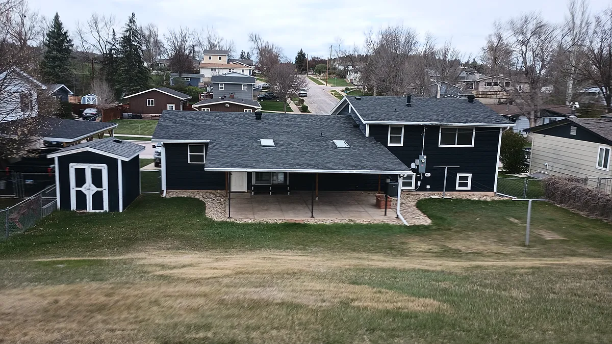 Back of house, Large backyard and covered patio - 4725 Baldwin St