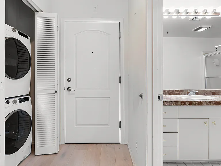 Entrance. Bathroom on the left, laundry area on the right.