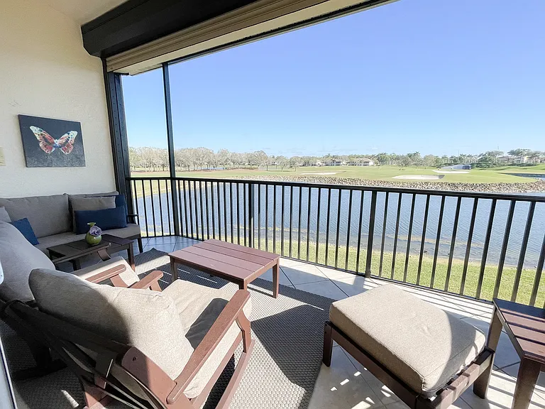 Private Lanai with panoramic screening overlooking 18th green of the Mustang Course at Lely Resort