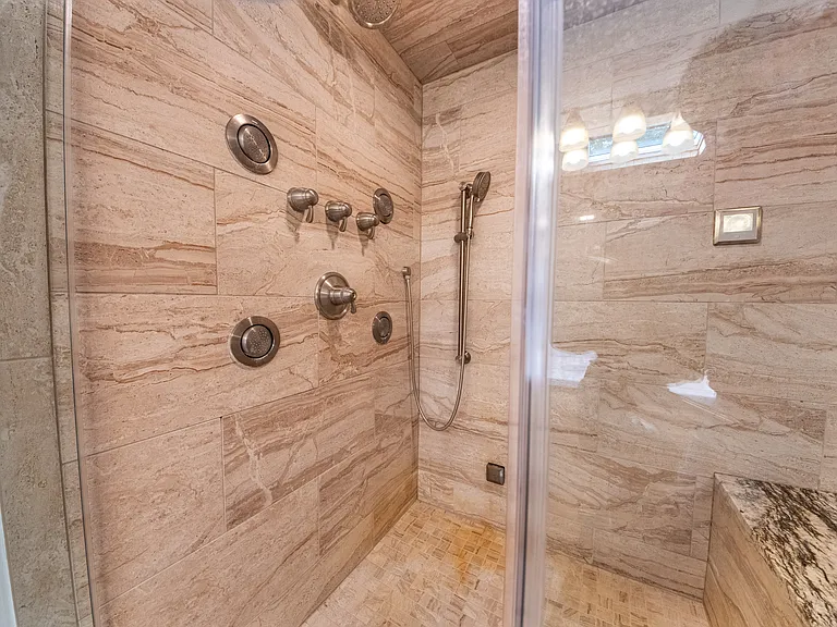 New steam shower with granite tiles.