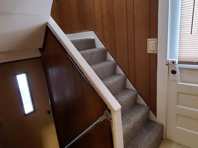 Stairway to Basement and Upstair Room in Attic
