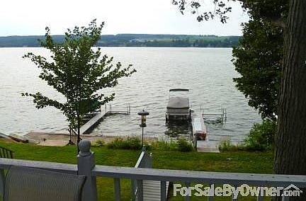 View from the upstairs deck : You can see across the lake, and the dock and our pontoon/party boat.