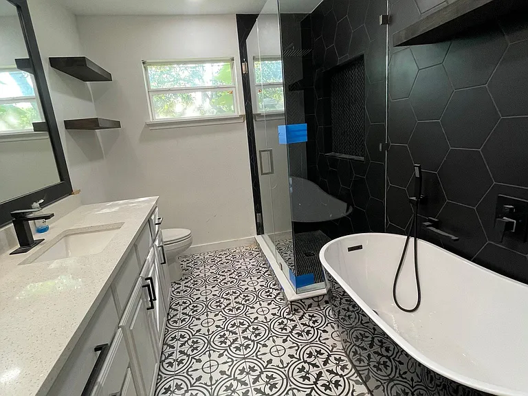Main bathroom with standing tub and shower