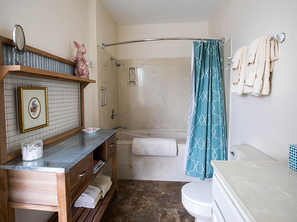 Large updated bathroom with counter space and jetted tub